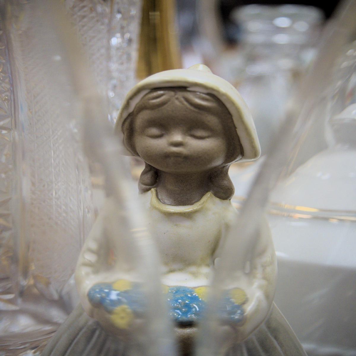 Percelaine doll in an antique shop